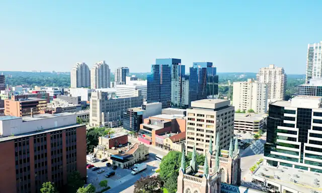 Aerial view of downtown London, Ontario, featuring modern buildings and historic architecture.
