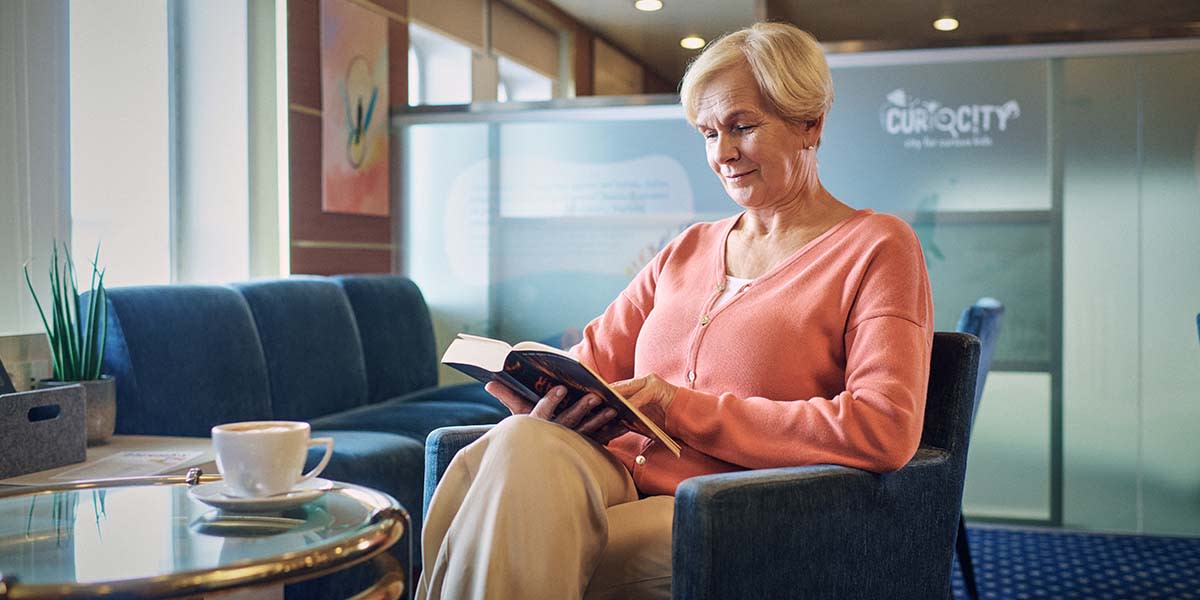Woman reading a book onboard