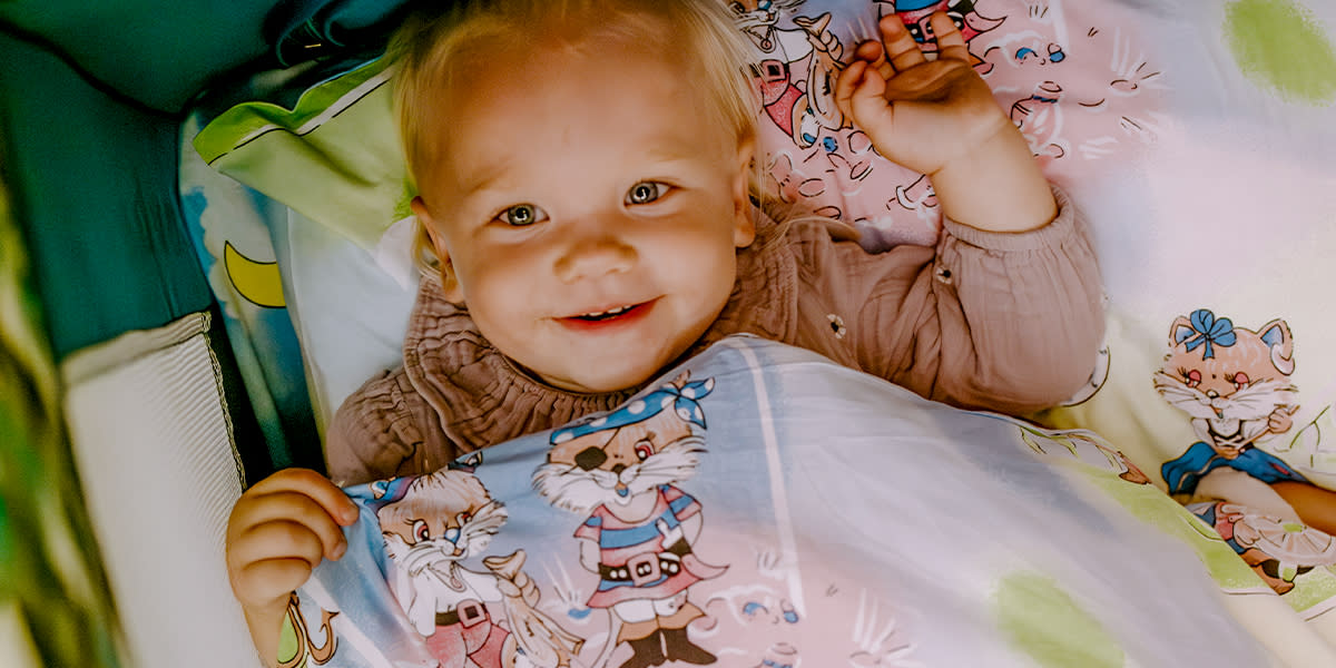 Family offer Kid in the baby cot onboard DFDS ferry