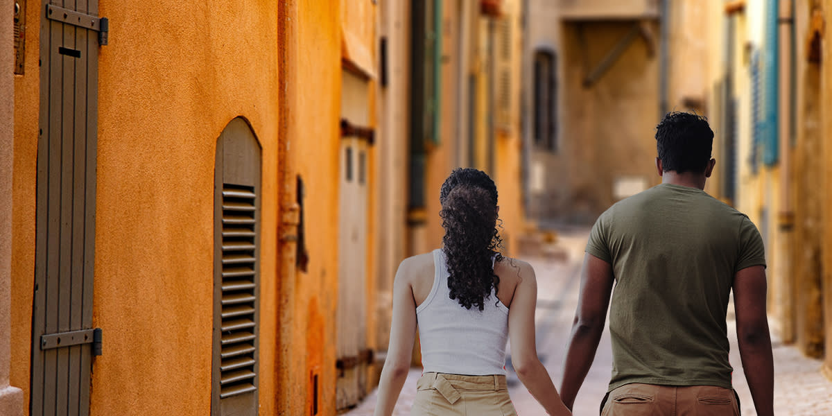 Couple walking through a city