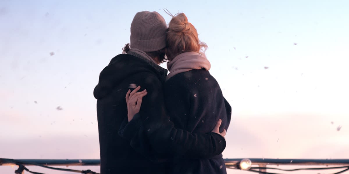 Snowy deck with couple