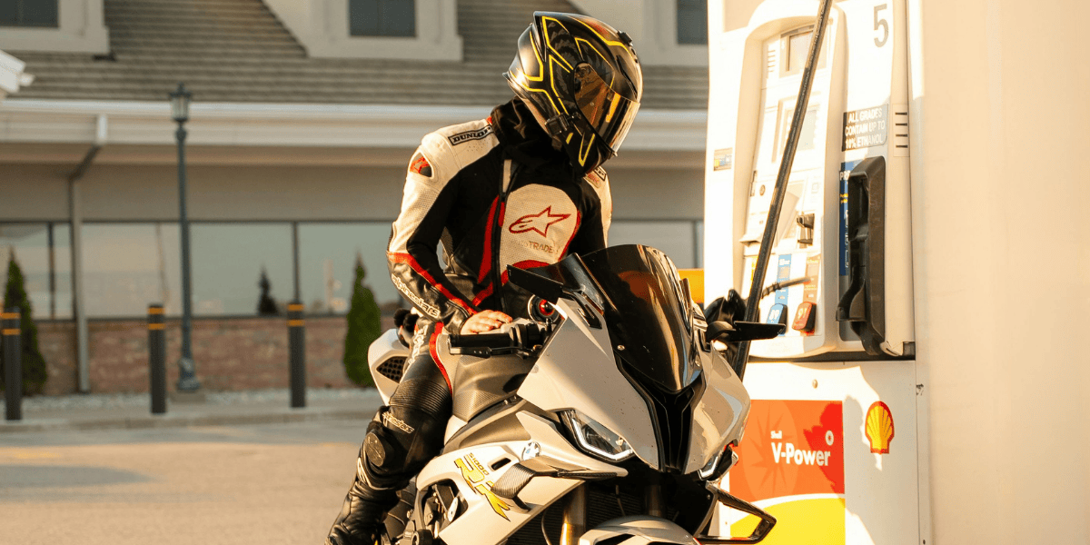Motorcyclist at the gas station Motorcyclist at the gas station
