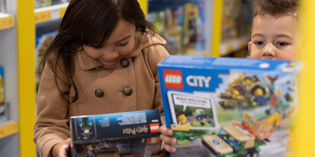 Children looking at lego in Duty Free