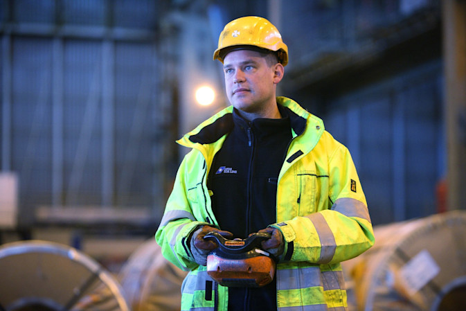 DFDS warehouse employee inspecting metal coils