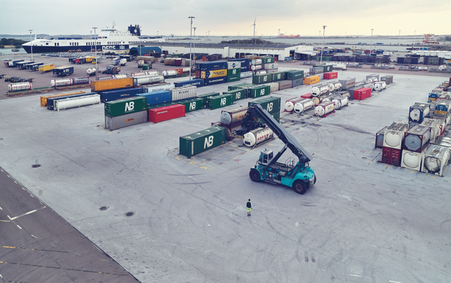 DFDS Freight forklift loading shipping containers at a terminal