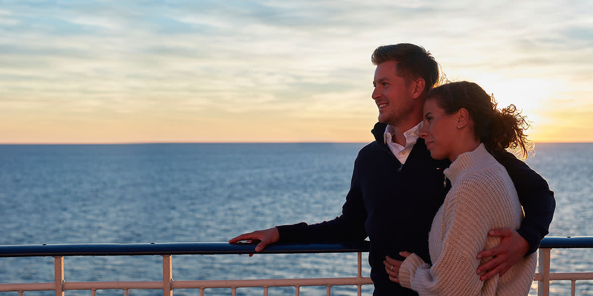 Couple on deck - sunset - Hero