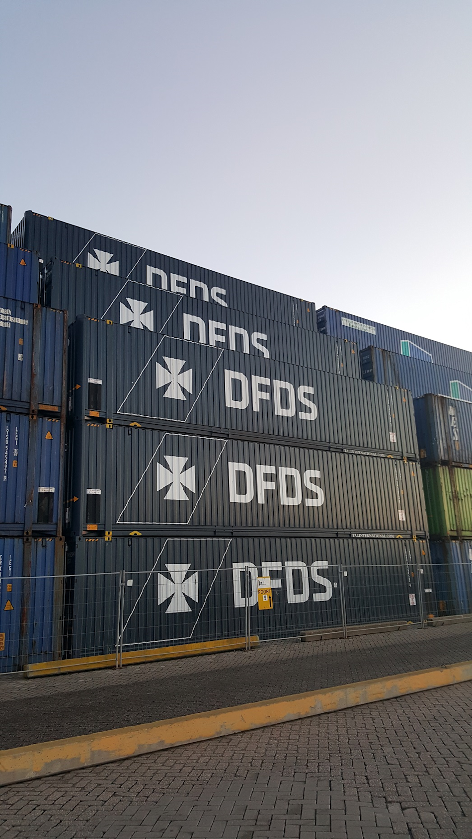 DFDS Shipping containers stacked in a shipping yard
