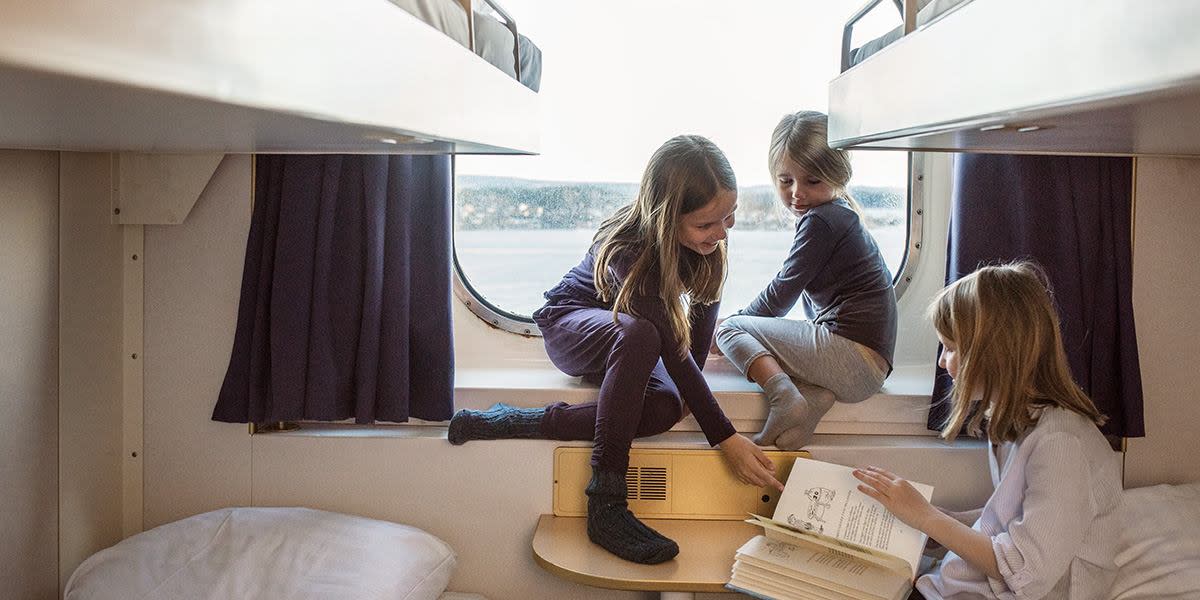 children-in-a-cabin-with-window-family-time