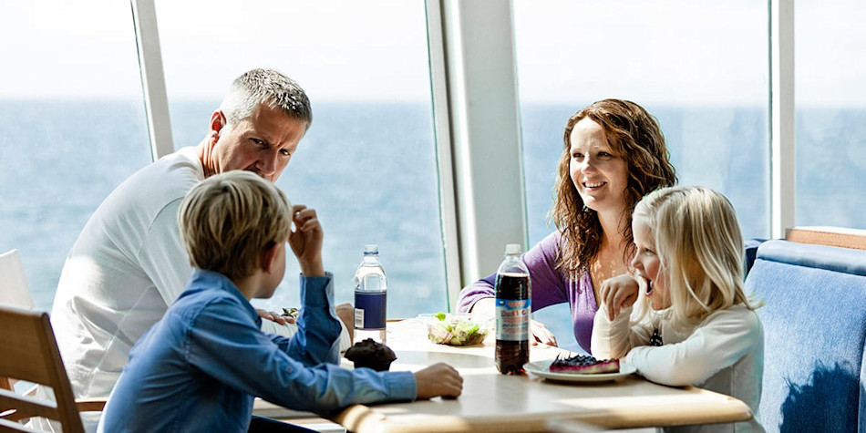 Family of four having a meal at 7 Seas restaurant onboard Eastern Channel Ferry.