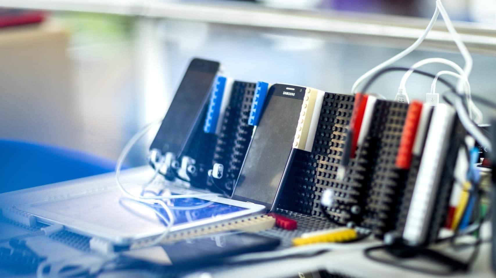 Purpose & Strategy page, About section, Pillar B Standardise to Simplify - Samsung mobile phones & LEGO blocks in a testing environment 11403-dfds 0876 1702066906273