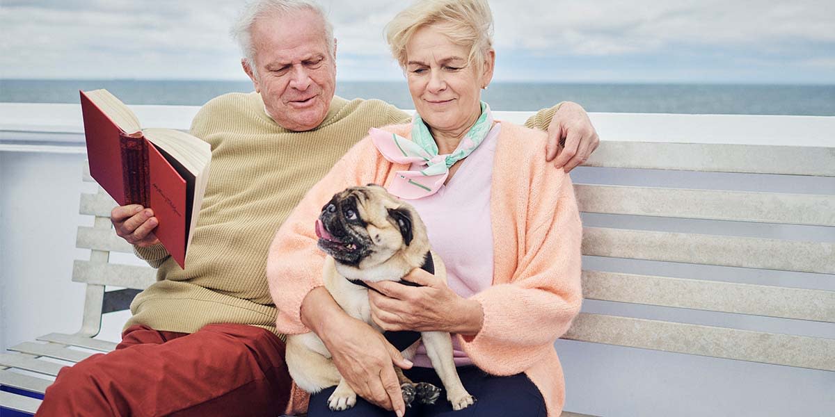 Couple with a dog on the deck