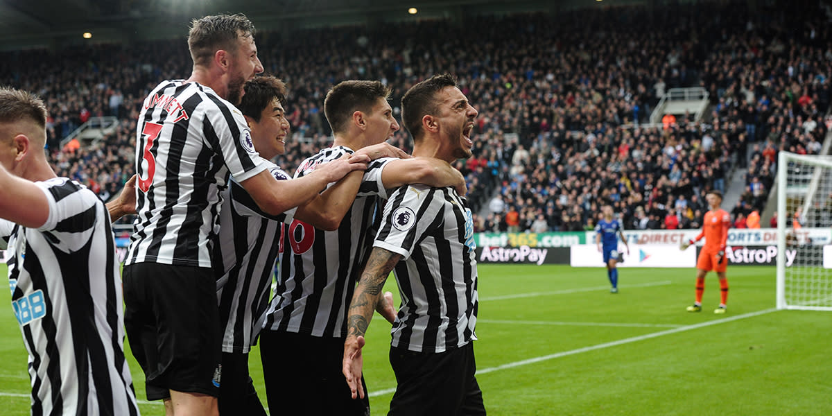 Football players celebrating a goal at Newcastle United football club NUFC