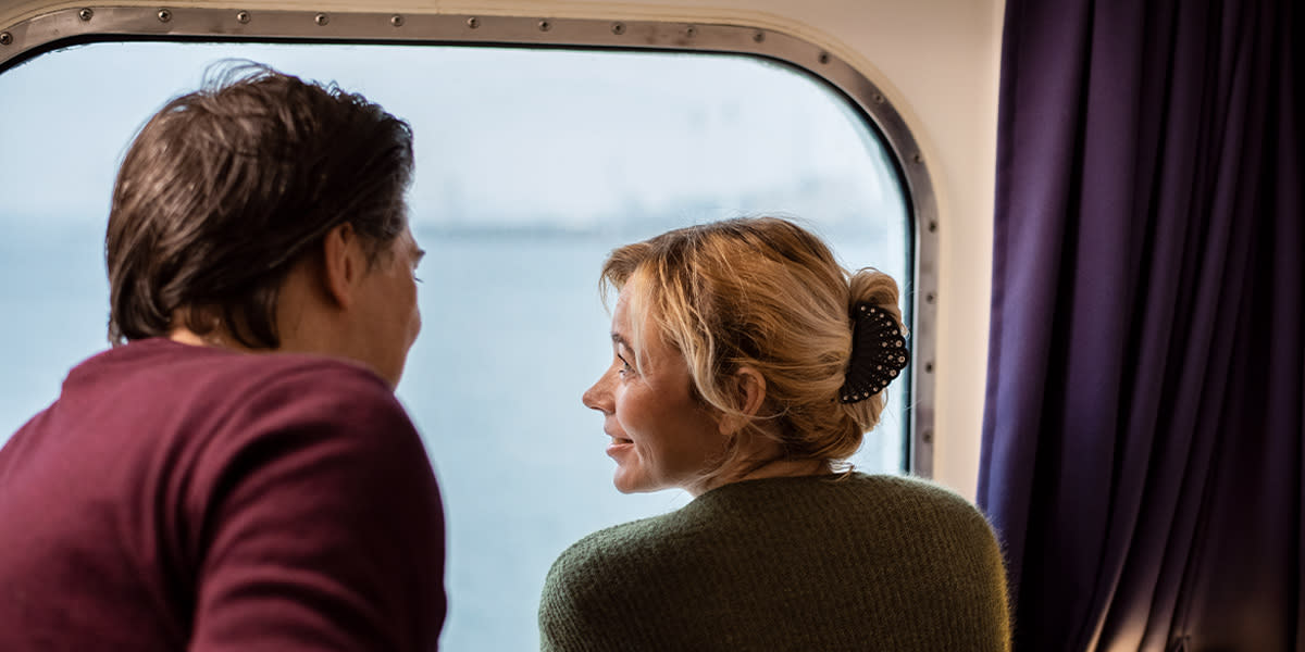 Couple watching at each other onboard
