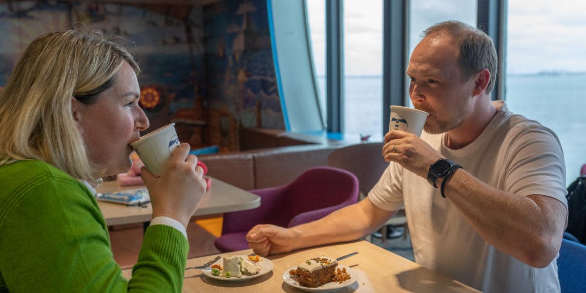 Man drinking beverage from Lighthouse Cafe 09 2025 