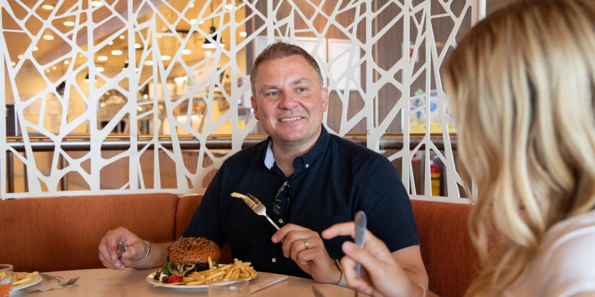 Couple enjoying a meal on Athena Seaways (exp June 2027)