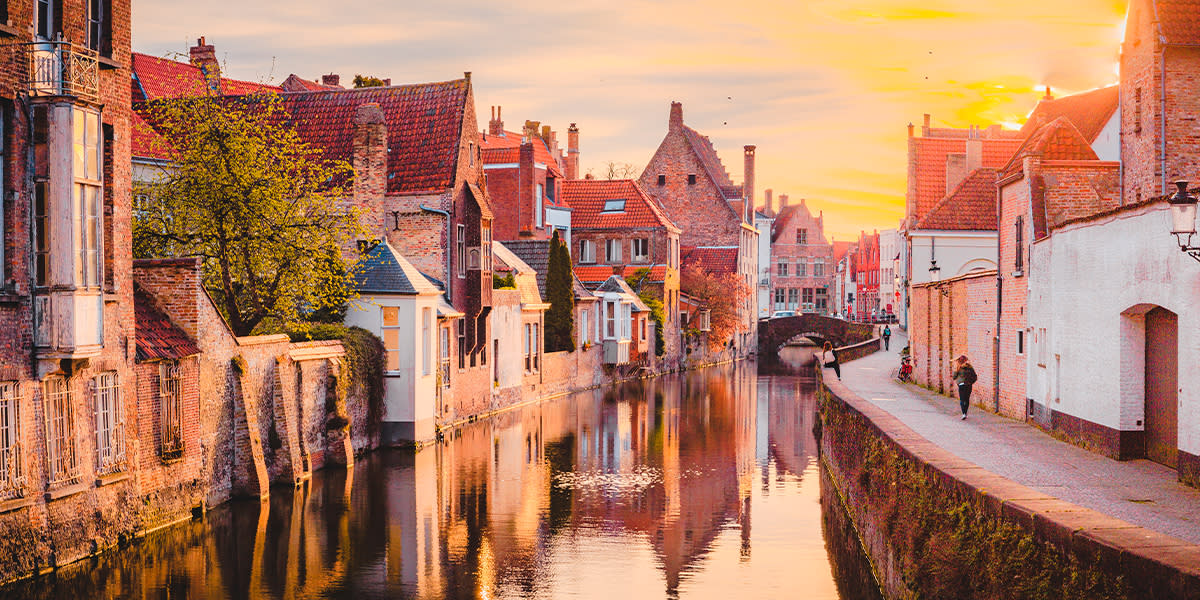 Bruges canal with the sun setting