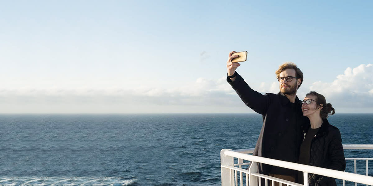 Couple on deck taking selfie