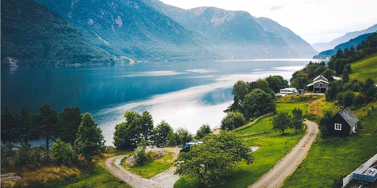 Norwegian countryside with mountains Hero Norwegian countryside with mountains Hero