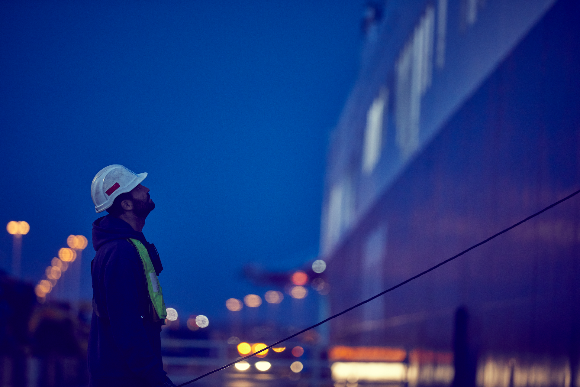 DFDS employee looking up at night time