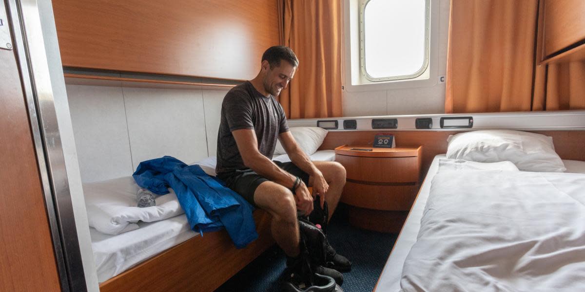 Individual enjoying a cabin on Athena Seaways (exp June 2027)