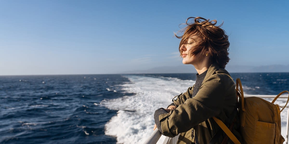 Woman enjoying fresh air on deck