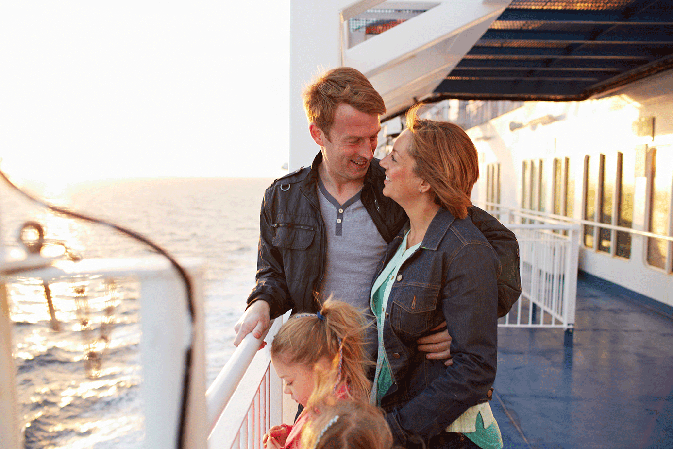 Family on deck at sunset