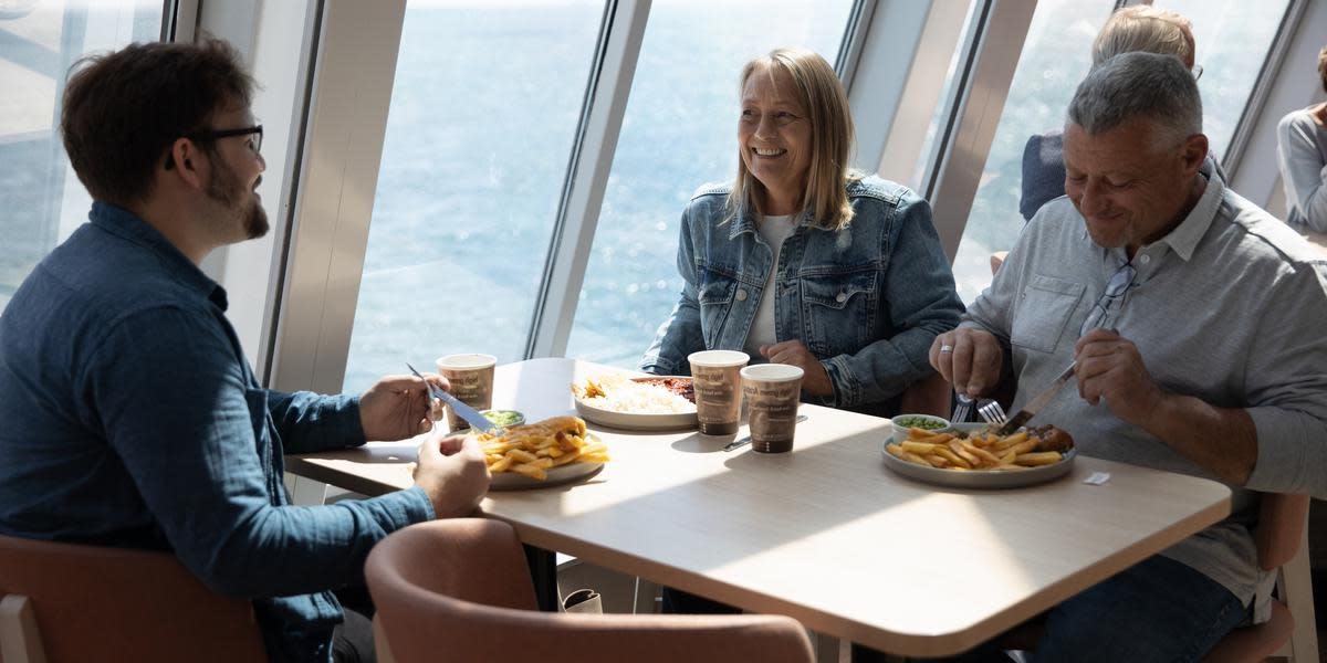 Family enjoying a meal on Delft Seaways HERO Family enjoying a meal on Delft Seaways HERO