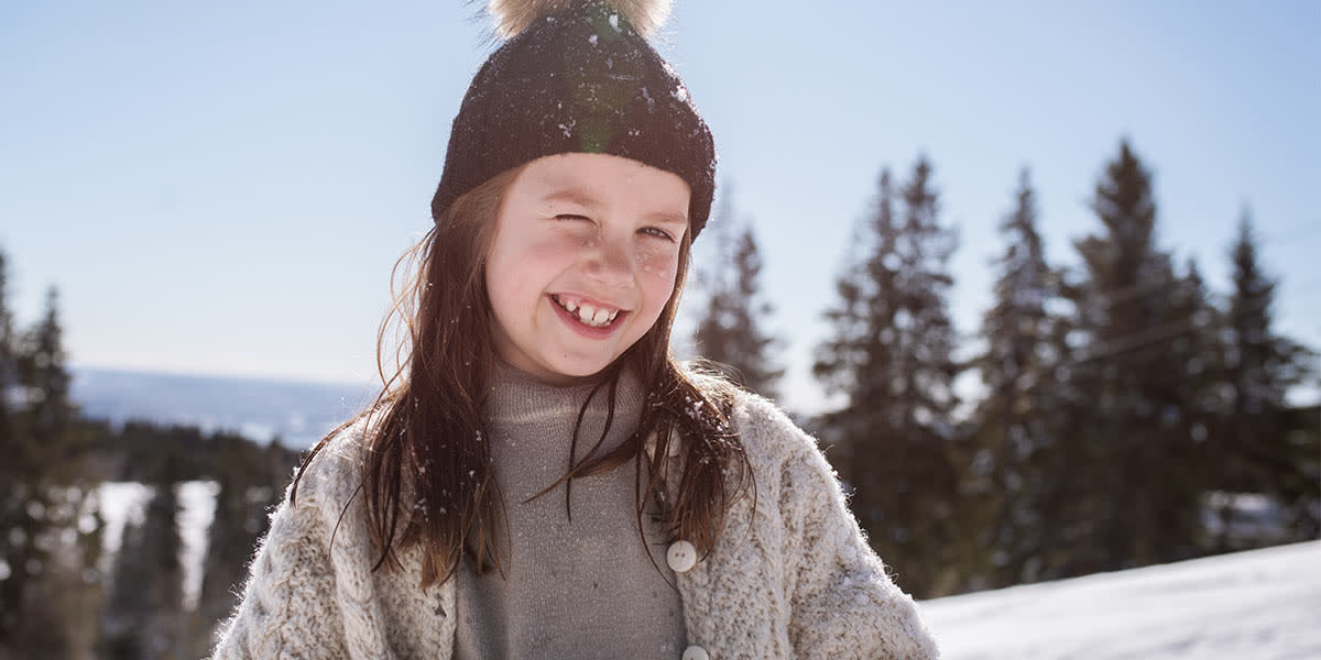 Girl Smiling with snow Promo