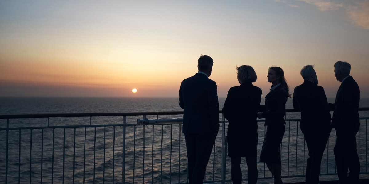 group admires the sunset