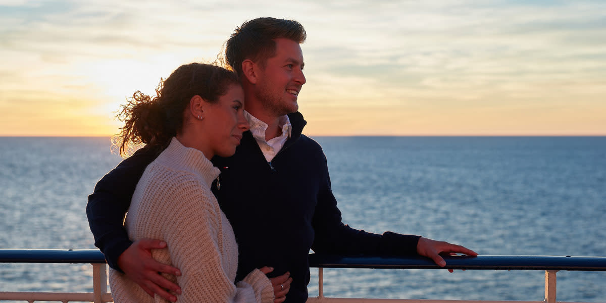 Couple on deck - sunset - Hero