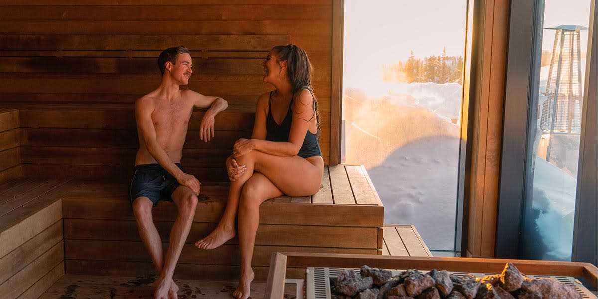 Couple speaking in sauna