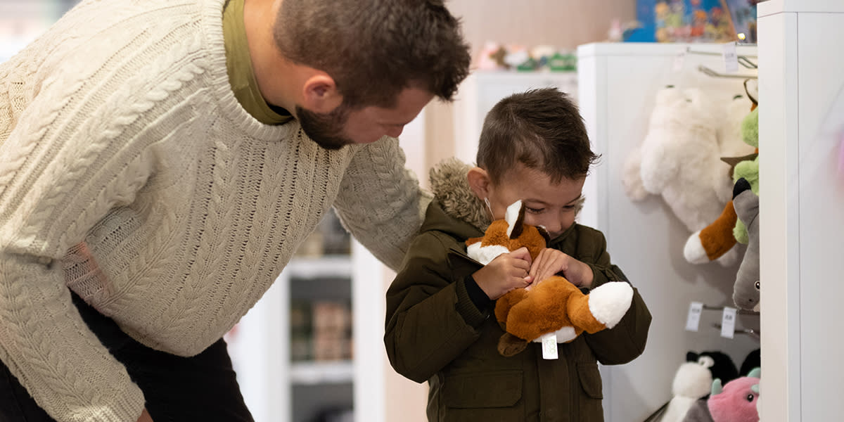 Child with Duty Free toy