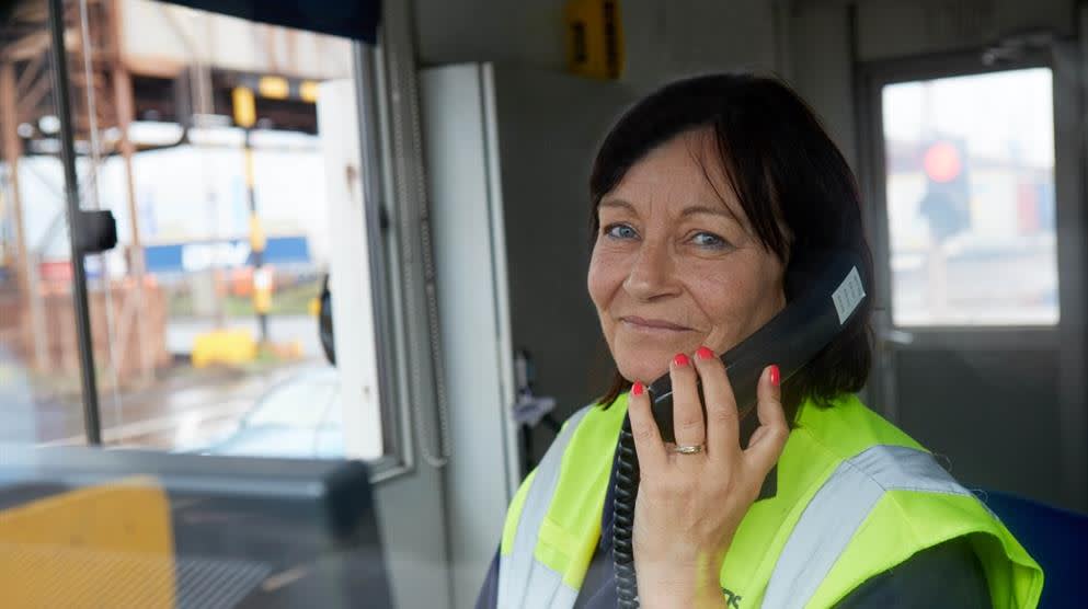 DFDS employee on the phone in a shipyard control tower DFDS Jobs