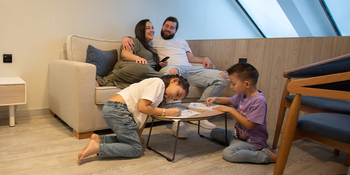 Family relaxing in the family cabin onboard DINE