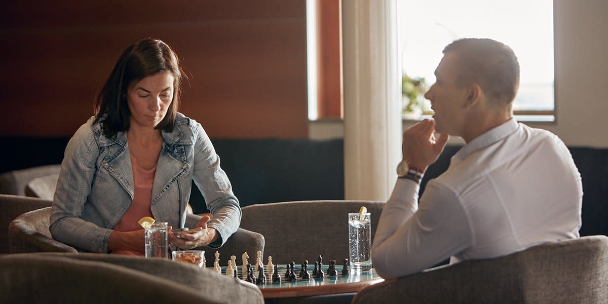 Couple playing games on board