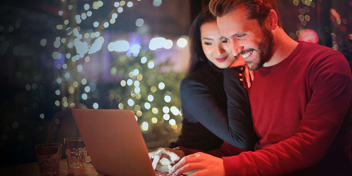 Christmas - couple with computer