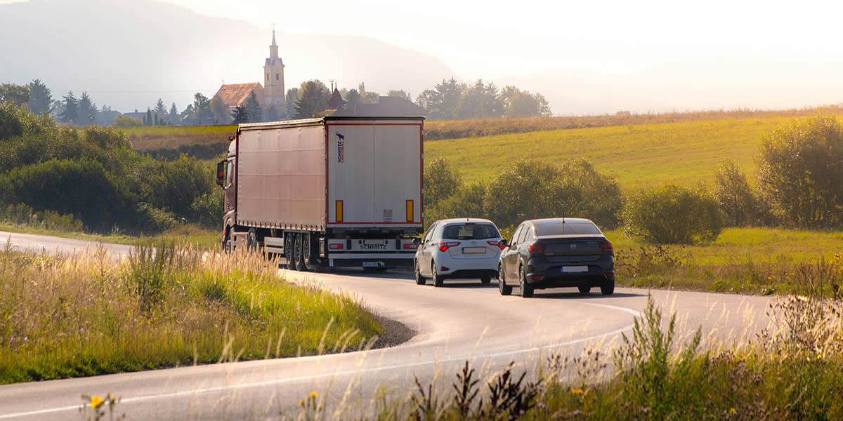 Cars driving behind lorry