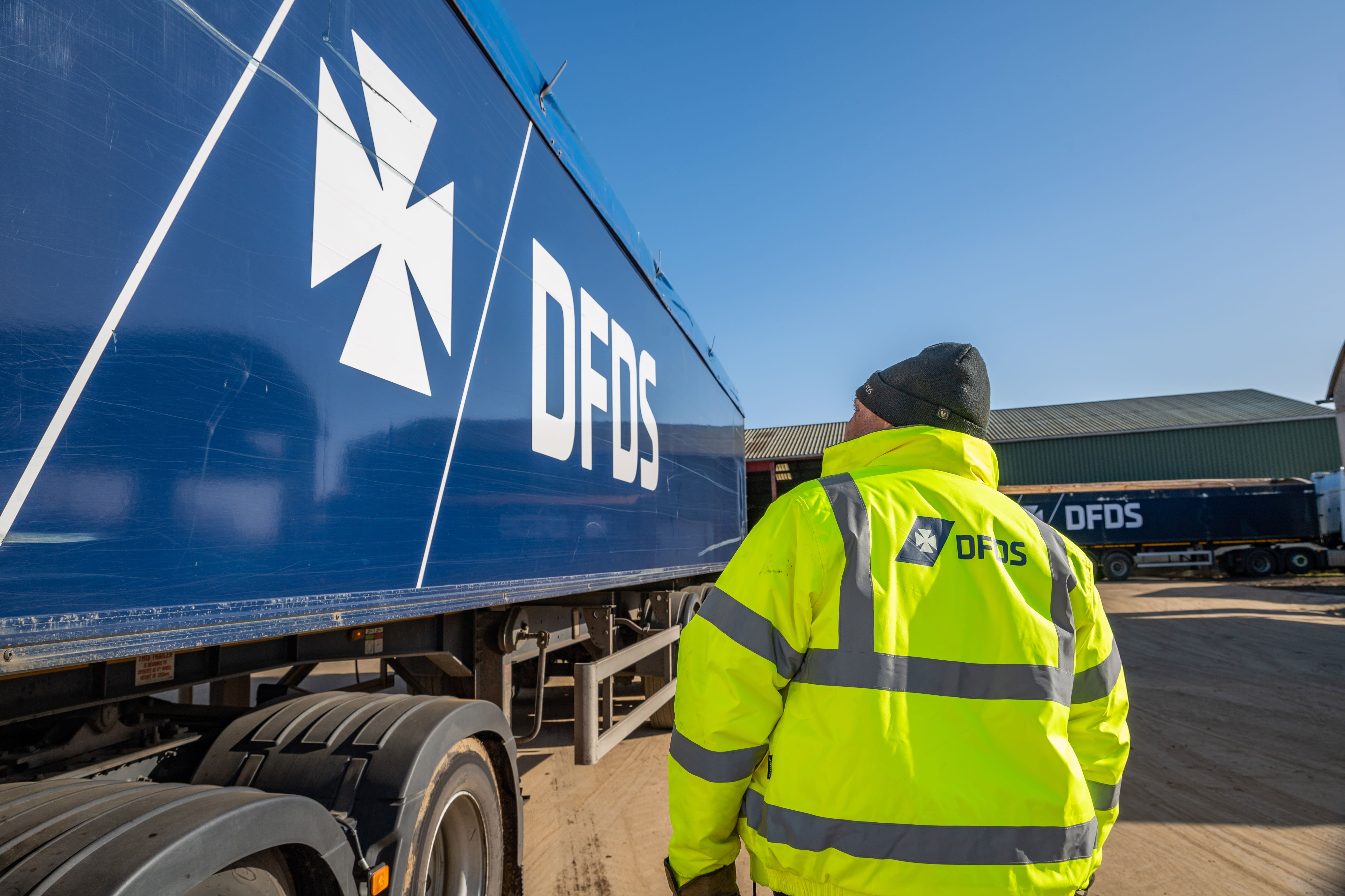 Blue DFDS truck and worker