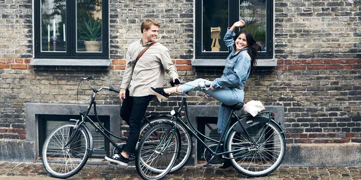 Couple cycling in a city