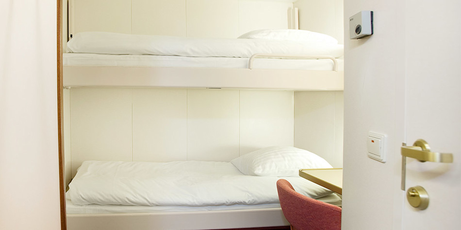 A bunk bed in an economy cabin 