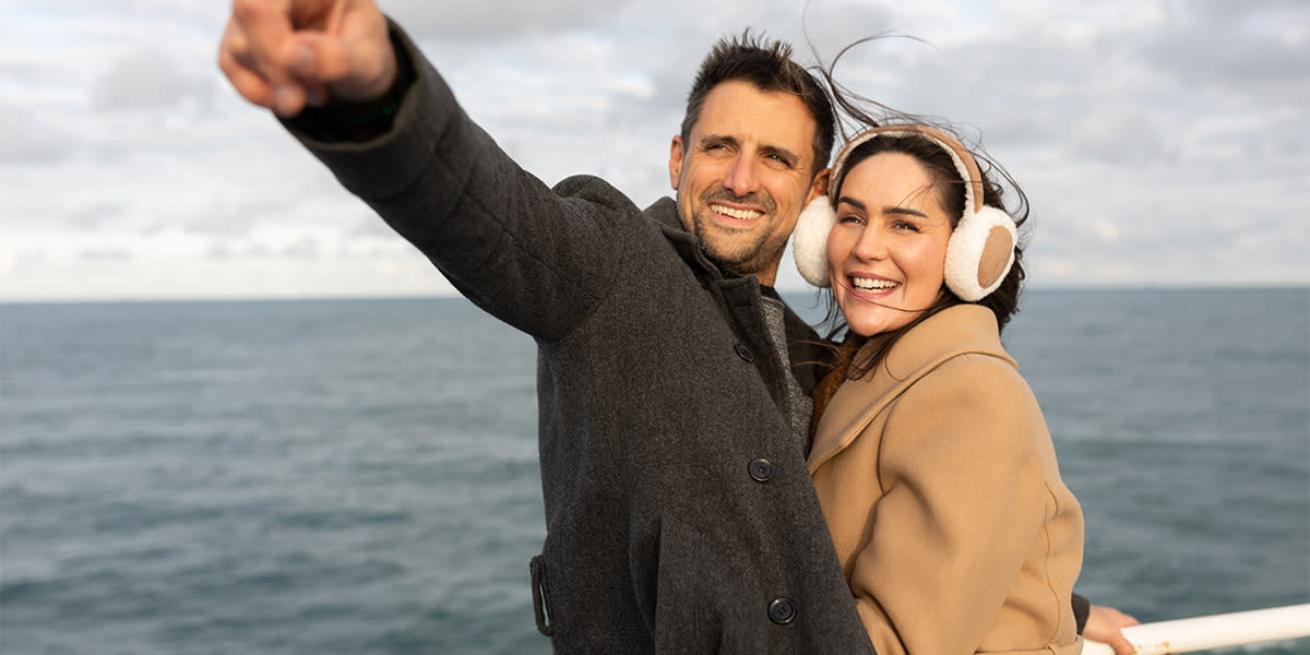 Couple pointing onboard DFDS ship