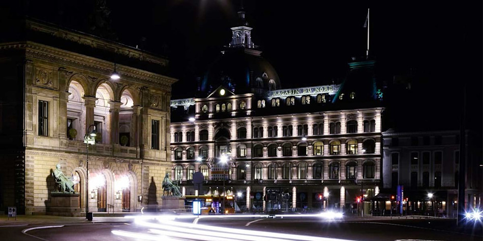 Magasin du Nord lit up at night time in Denmark 