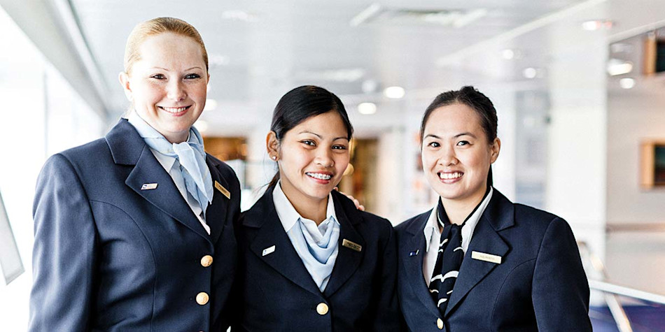 Three customer service staff smiling 