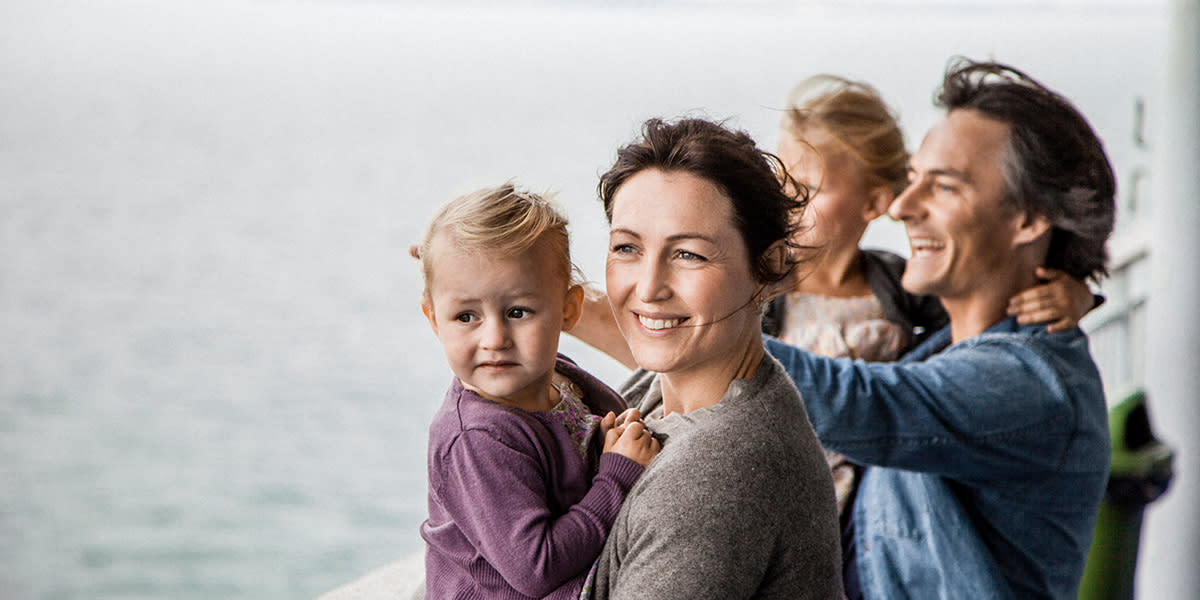 Family on deck looking out to sea