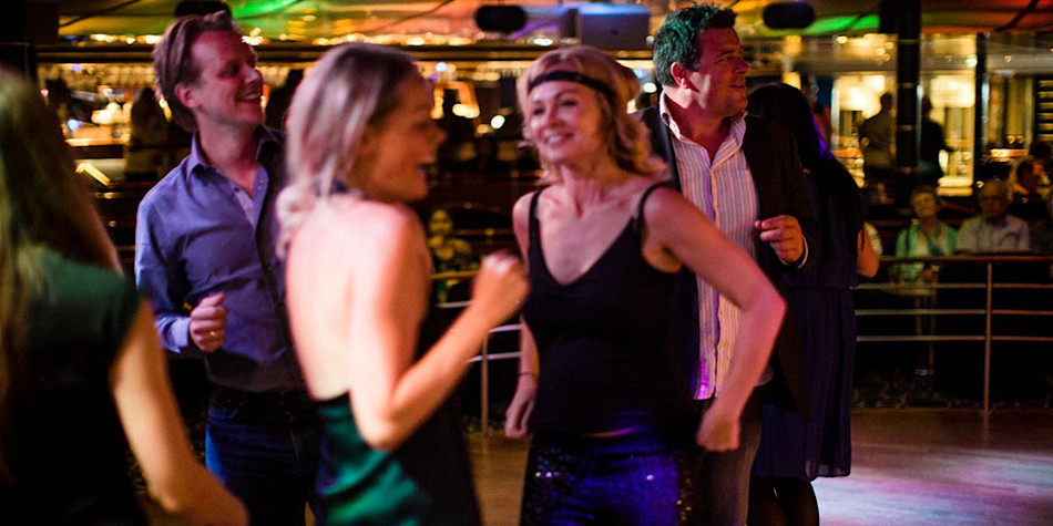 People dancing live entertainment onboard 