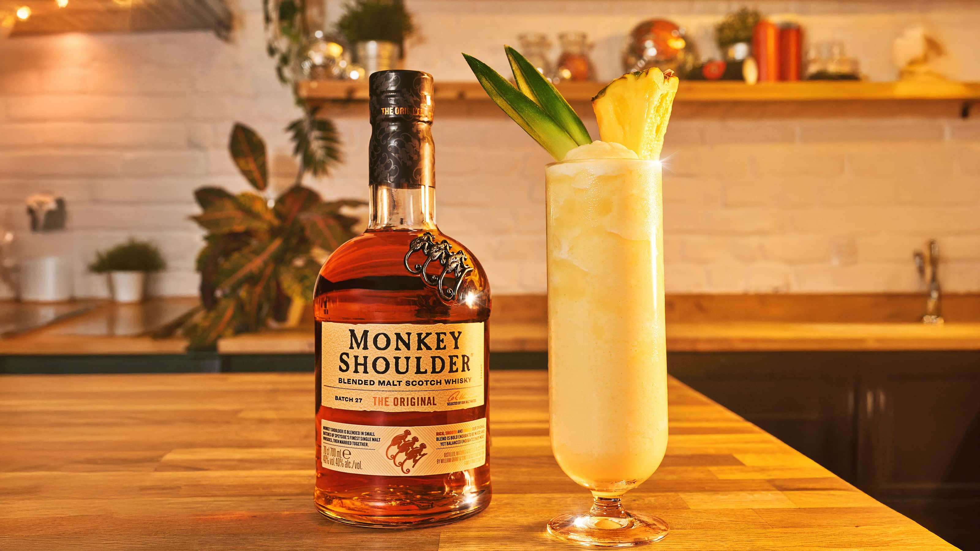 Asset: Image: Monkey Colada Serve and Bottle on table 16x9