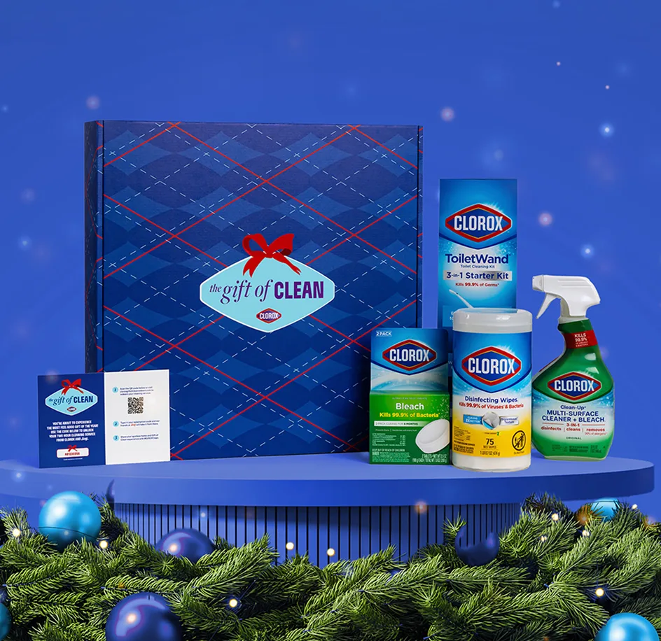 Gift of Clean box with products on a table with blue background and garland in front