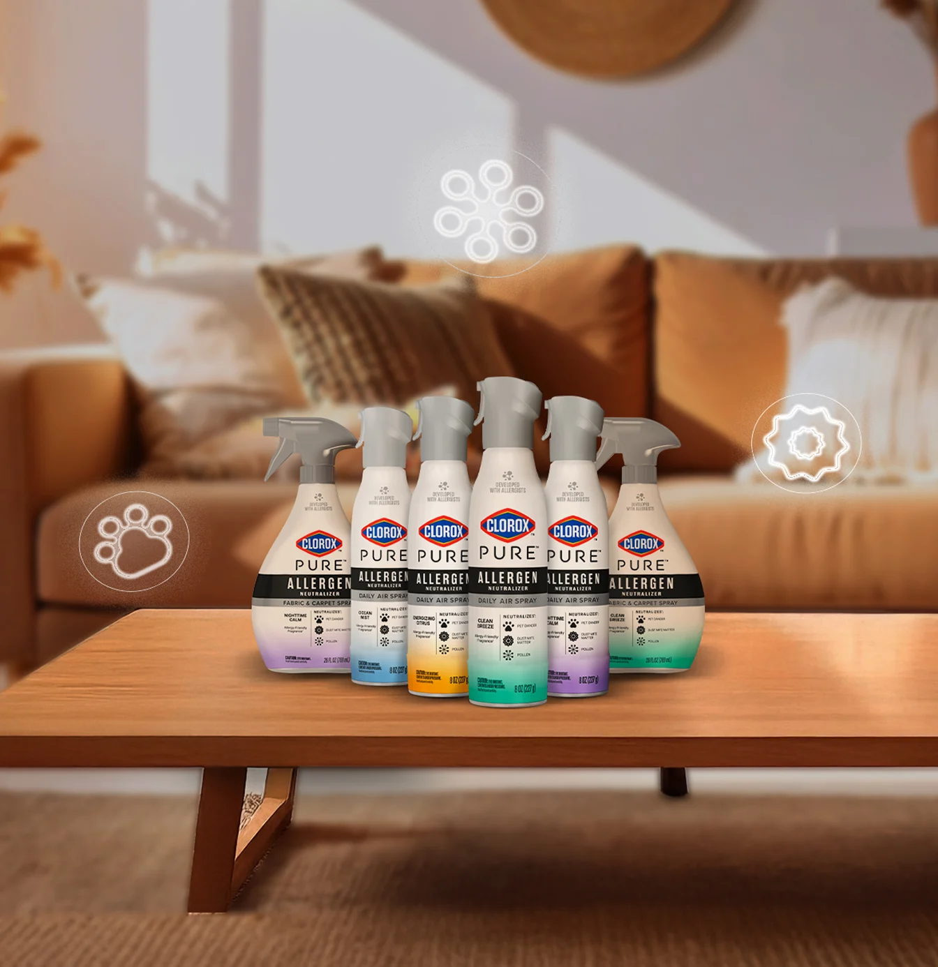 Family of Clorox PURE air care products on a coffee table in front of a couch