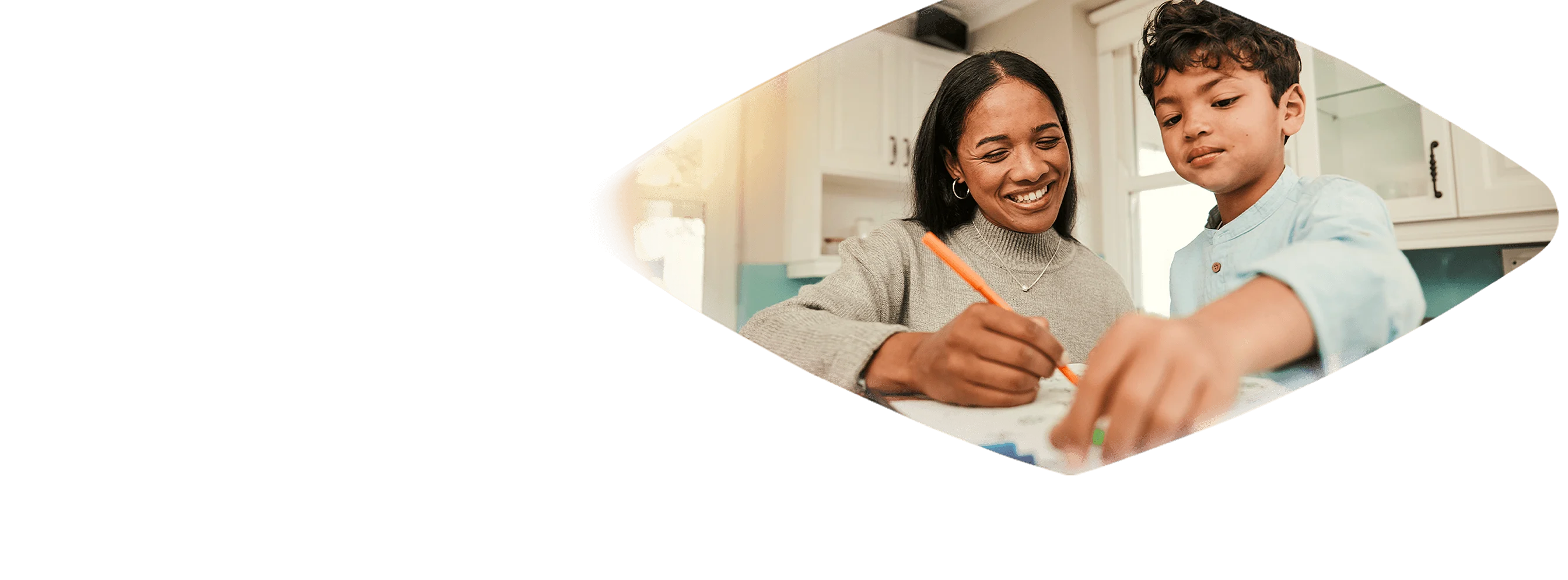 A woman helping a child with homework.