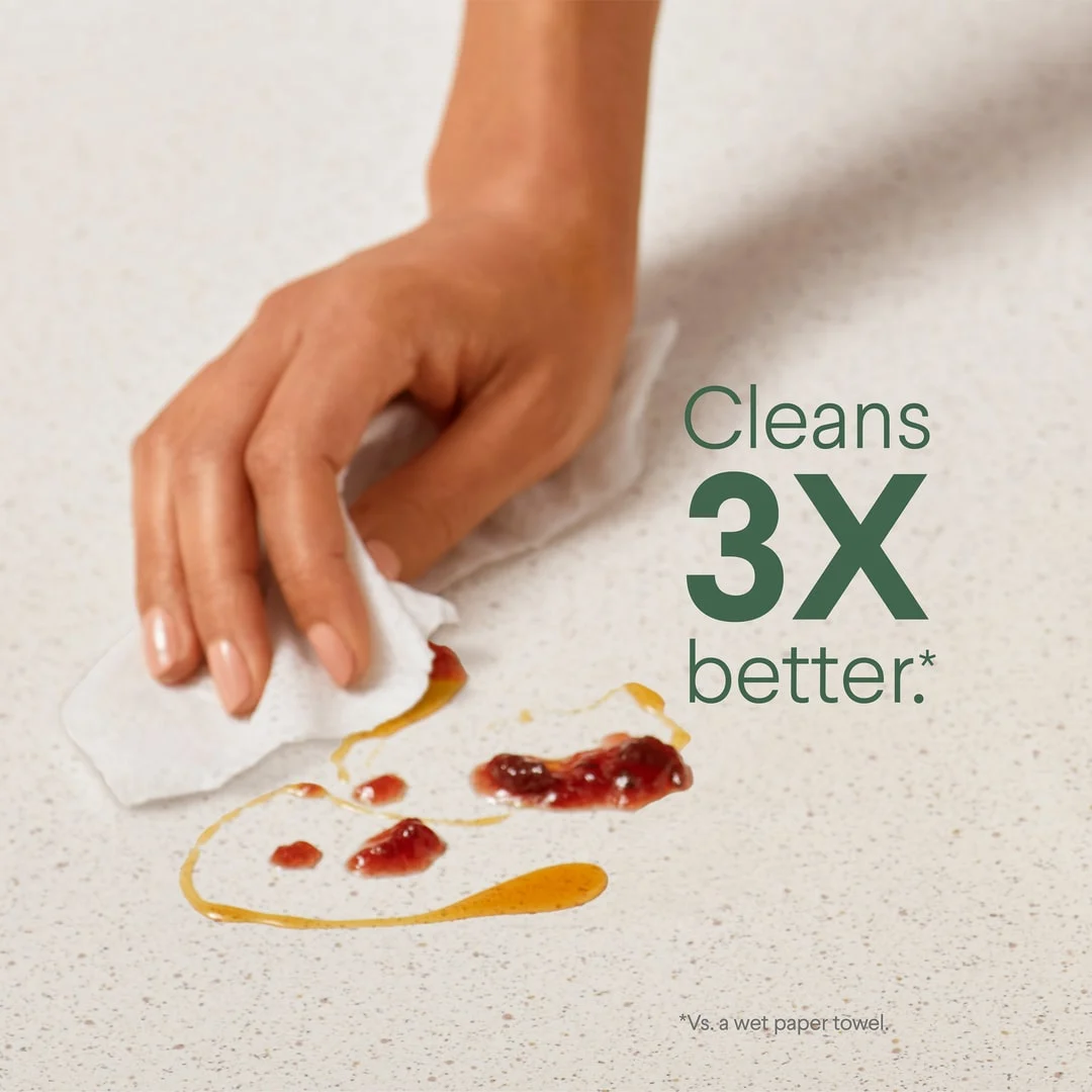 Cleans 3X better: a hand wiping a spilled mess